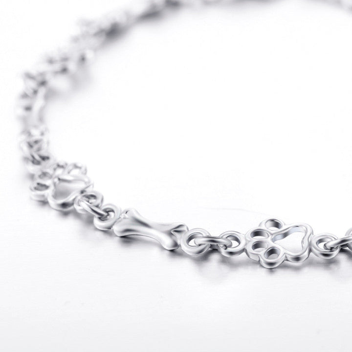 Bracelet with Dog Paw and Bone Charms in Silver